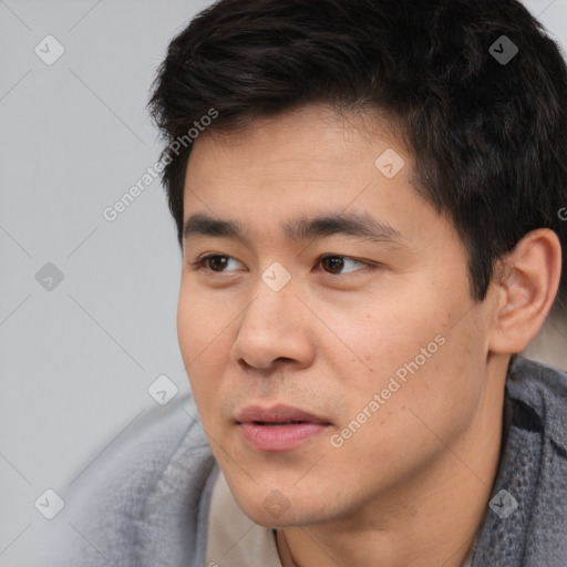 Neutral white young-adult male with short  black hair and brown eyes