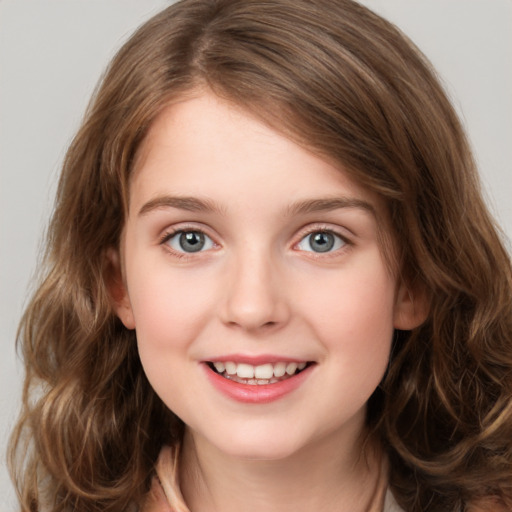 Joyful white child female with medium  brown hair and green eyes