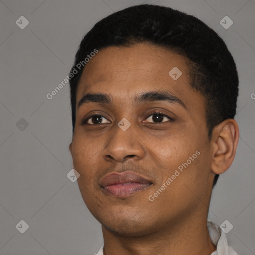 Joyful black young-adult male with short  black hair and brown eyes