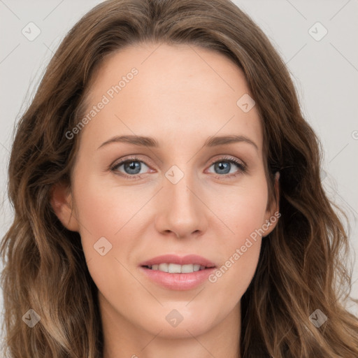 Joyful white young-adult female with long  brown hair and blue eyes