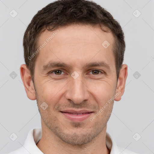 Joyful white adult male with short  brown hair and brown eyes