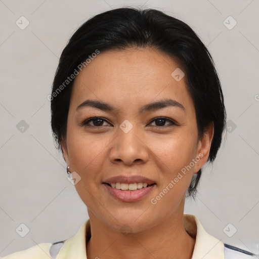 Joyful asian young-adult female with medium  black hair and brown eyes