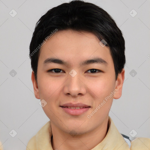 Joyful asian young-adult male with short  black hair and brown eyes