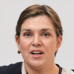 Joyful white adult female with short  brown hair and grey eyes