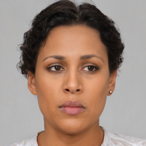 Neutral latino young-adult female with short  brown hair and brown eyes