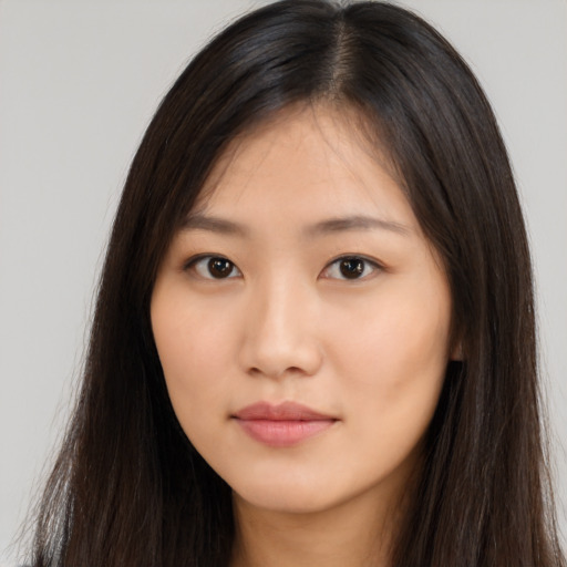 Neutral asian young-adult female with long  brown hair and brown eyes