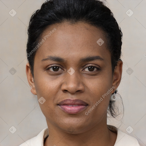 Joyful black young-adult female with short  brown hair and brown eyes