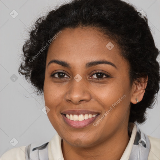 Joyful black young-adult female with medium  brown hair and brown eyes