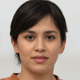 Joyful white young-adult female with medium  brown hair and brown eyes