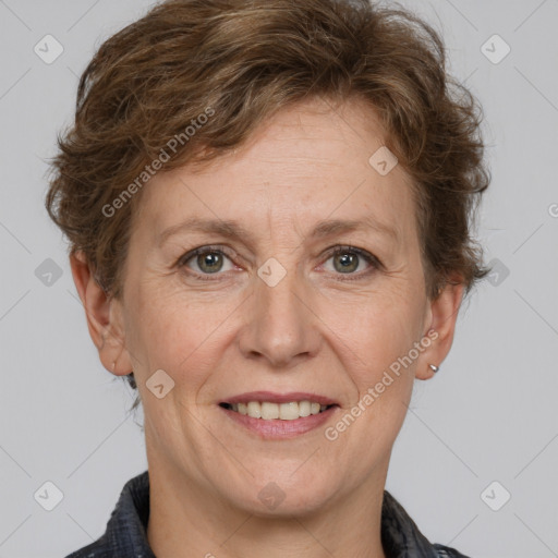 Joyful white adult female with short  brown hair and grey eyes