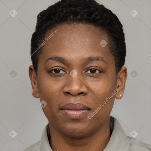 Joyful black young-adult female with short  black hair and brown eyes