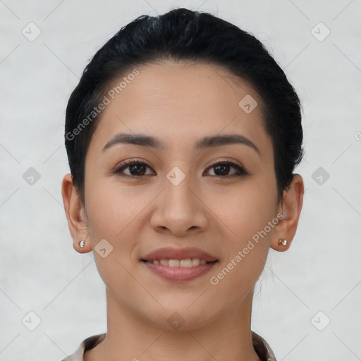 Joyful asian young-adult female with short  black hair and brown eyes