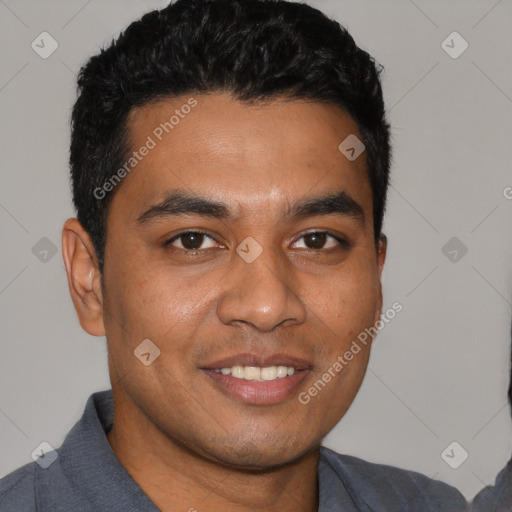Joyful white young-adult male with short  black hair and brown eyes