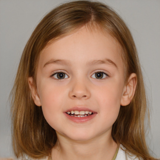 Joyful white child female with medium  brown hair and brown eyes