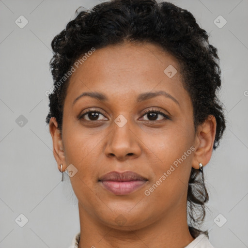 Joyful latino adult female with short  brown hair and brown eyes