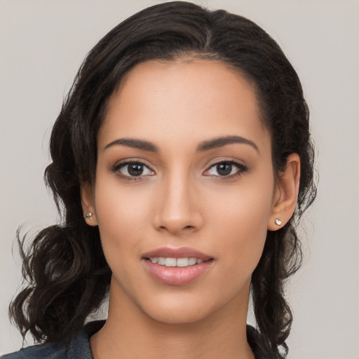 Joyful white young-adult female with long  black hair and brown eyes