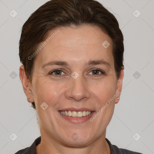 Joyful white adult female with short  brown hair and brown eyes