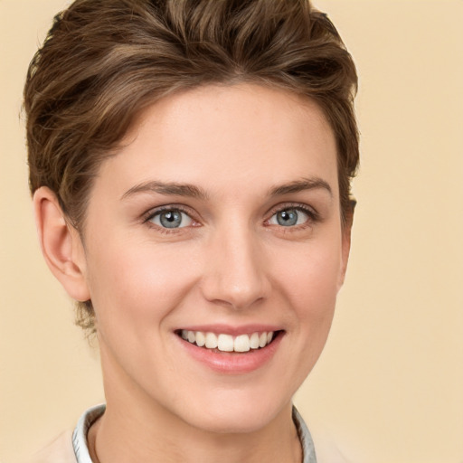 Joyful white young-adult female with short  brown hair and grey eyes