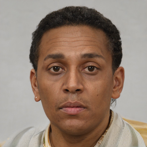 Neutral latino adult male with short  brown hair and brown eyes