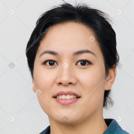 Joyful asian young-adult female with medium  black hair and brown eyes