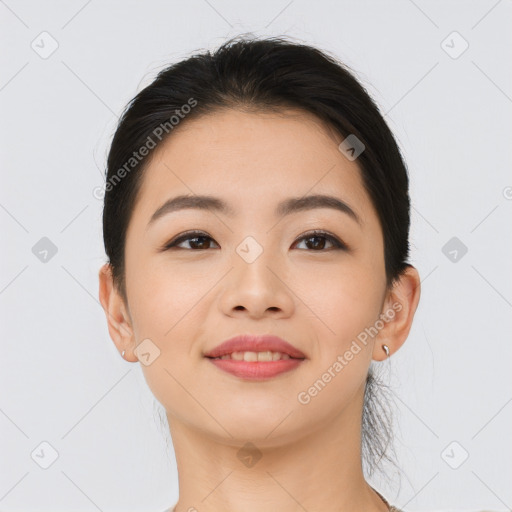 Joyful asian young-adult female with long  brown hair and brown eyes