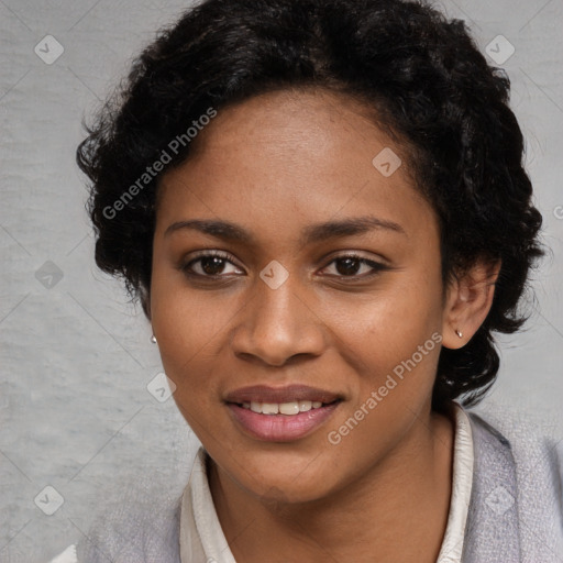 Joyful black young-adult female with long  black hair and brown eyes