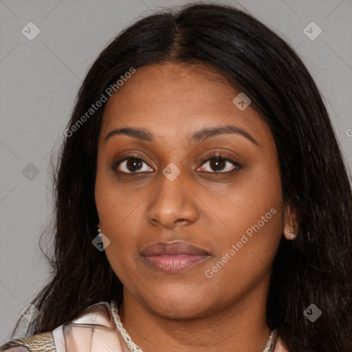 Joyful latino young-adult female with long  brown hair and brown eyes