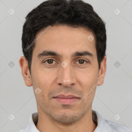 Joyful white young-adult male with short  black hair and brown eyes