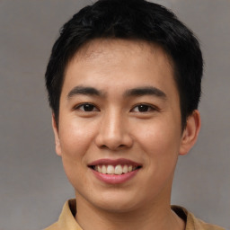 Joyful asian young-adult male with short  black hair and brown eyes