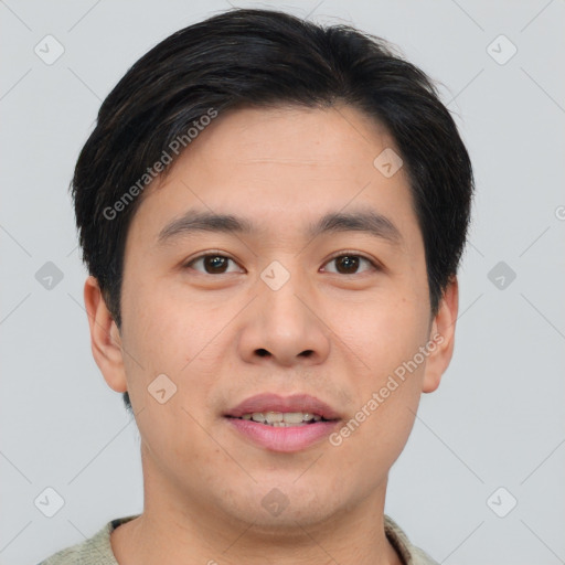 Joyful asian young-adult male with short  brown hair and brown eyes