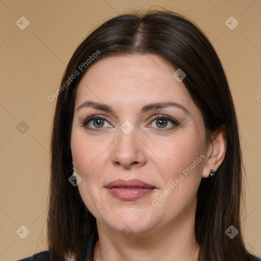 Joyful white adult female with long  brown hair and brown eyes