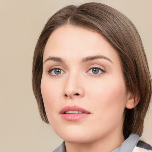 Neutral white young-adult female with medium  brown hair and green eyes