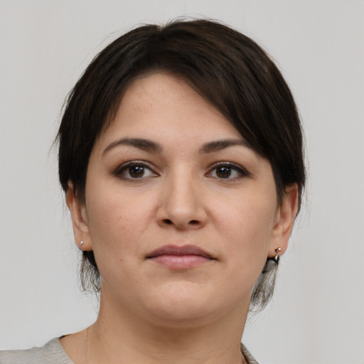 Neutral white young-adult female with medium  brown hair and brown eyes