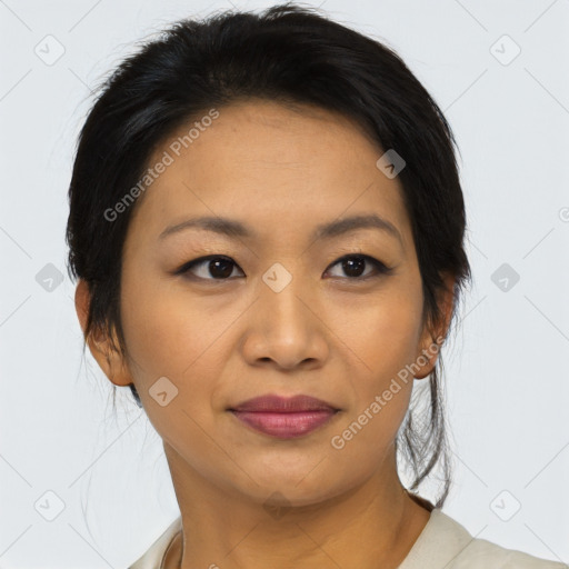 Joyful asian young-adult female with medium  black hair and brown eyes