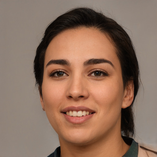 Joyful white young-adult female with medium  brown hair and brown eyes