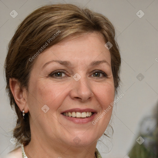 Joyful white adult female with medium  brown hair and green eyes