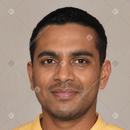 Joyful black young-adult male with short  black hair and brown eyes