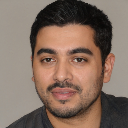 Neutral latino young-adult male with short  black hair and brown eyes