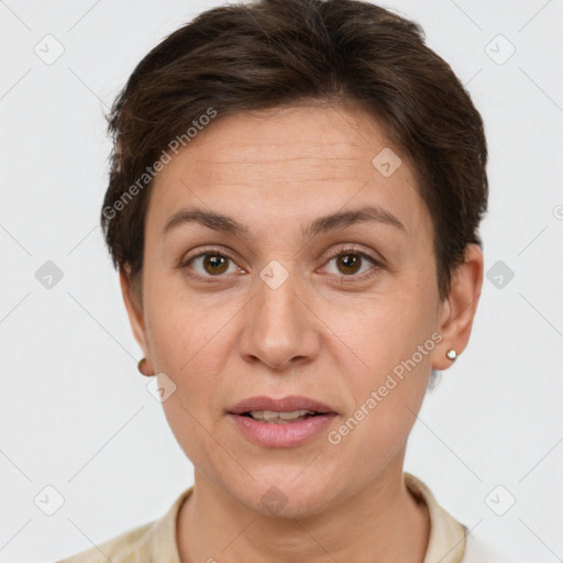 Joyful white adult female with short  brown hair and brown eyes