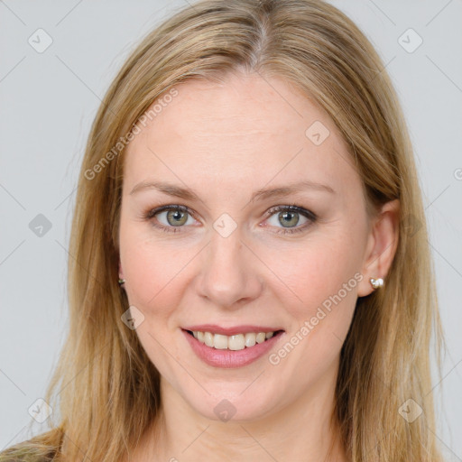 Joyful white young-adult female with long  brown hair and blue eyes