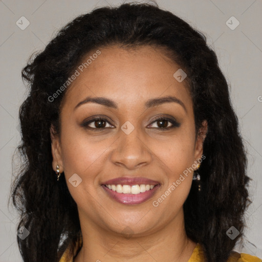 Joyful black adult female with long  brown hair and brown eyes