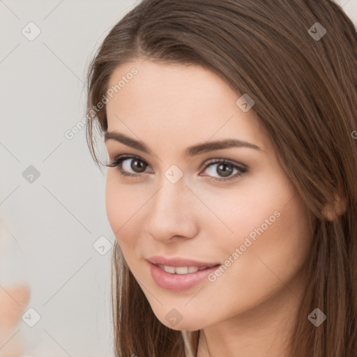 Neutral white young-adult female with long  brown hair and brown eyes