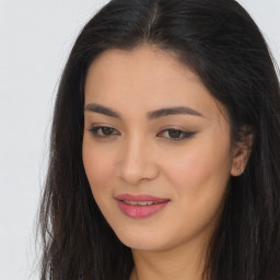 Joyful asian young-adult female with long  brown hair and brown eyes
