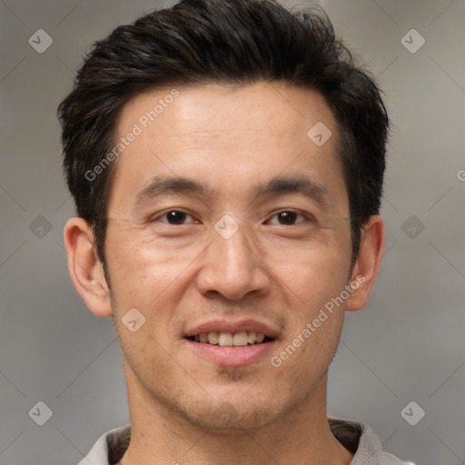 Joyful white adult male with short  brown hair and brown eyes