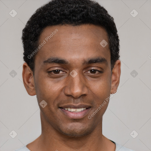 Joyful black young-adult male with short  black hair and brown eyes