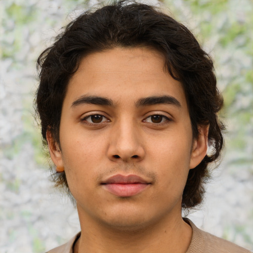 Neutral latino young-adult male with short  brown hair and brown eyes