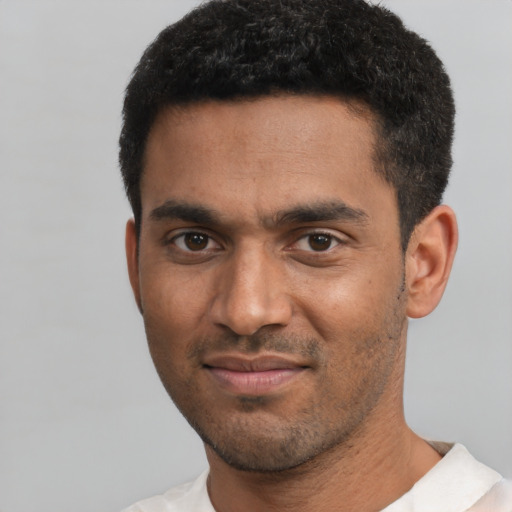 Neutral black young-adult male with short  black hair and brown eyes