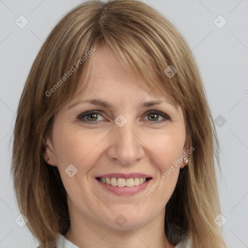 Joyful white adult female with medium  brown hair and grey eyes