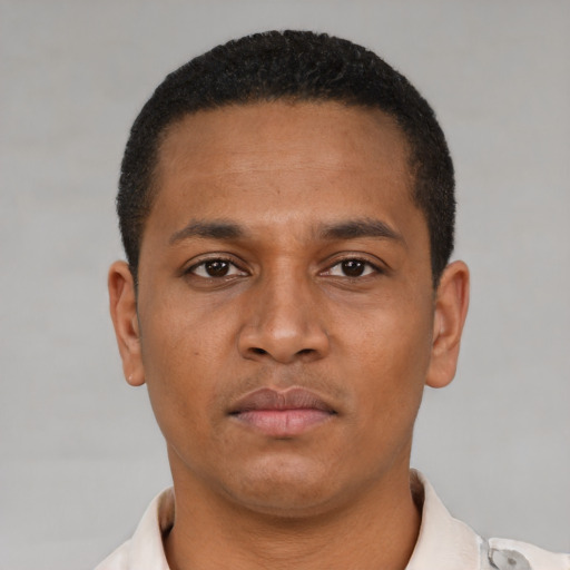 Neutral latino young-adult male with short  brown hair and brown eyes