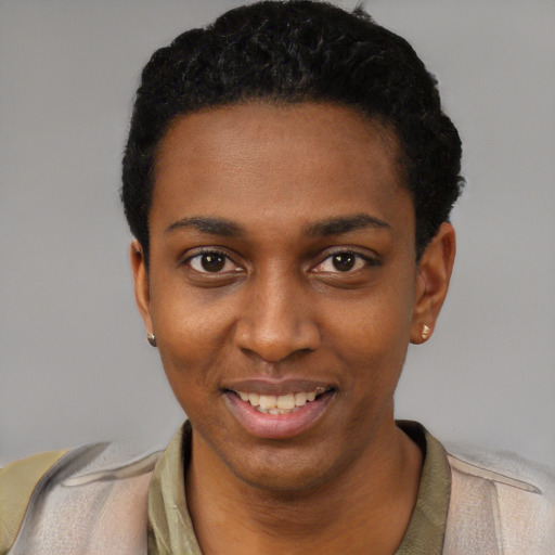 Joyful black young-adult female with short  black hair and brown eyes